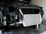 A side view of Polished Evolution Racewerks Audi A4 (B7) Competition Series Front Mount Intercooler (FMIC) Kit installed in a car