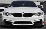 A front view of AUTOTECKNIC FRONT BUMPER DRY CARBON CANARD SET - BMW F80 M3 | F82/ F83 M4 2014+ fitted on a white car