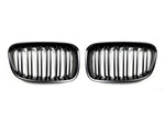 A front view of AUTOTECKNIC DUAL-SLATS STEALTH BLACK FRONT GRILLE SET - BMW F20 1-SERIES 2011-2019 with white background