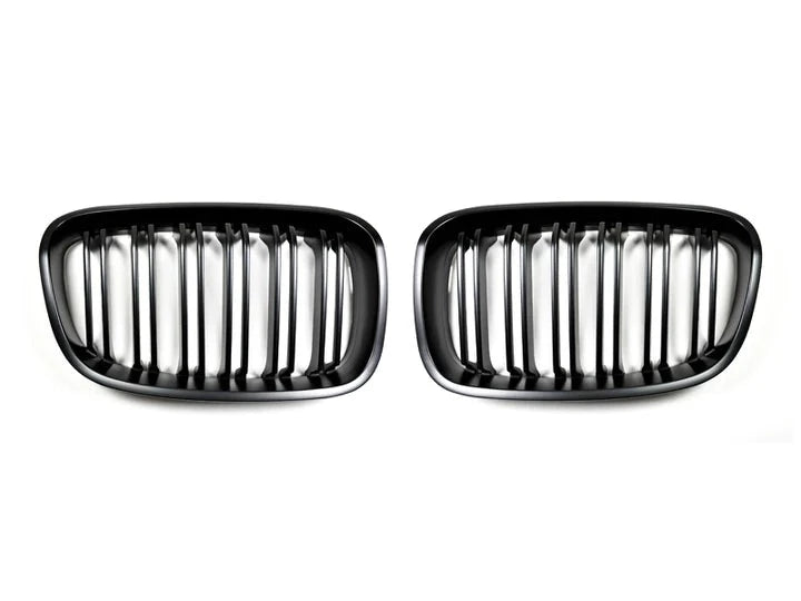 A front view of AUTOTECKNIC DUAL-SLATS STEALTH BLACK FRONT GRILLE SET - BMW F20 1-SERIES 2011-2019 with white background