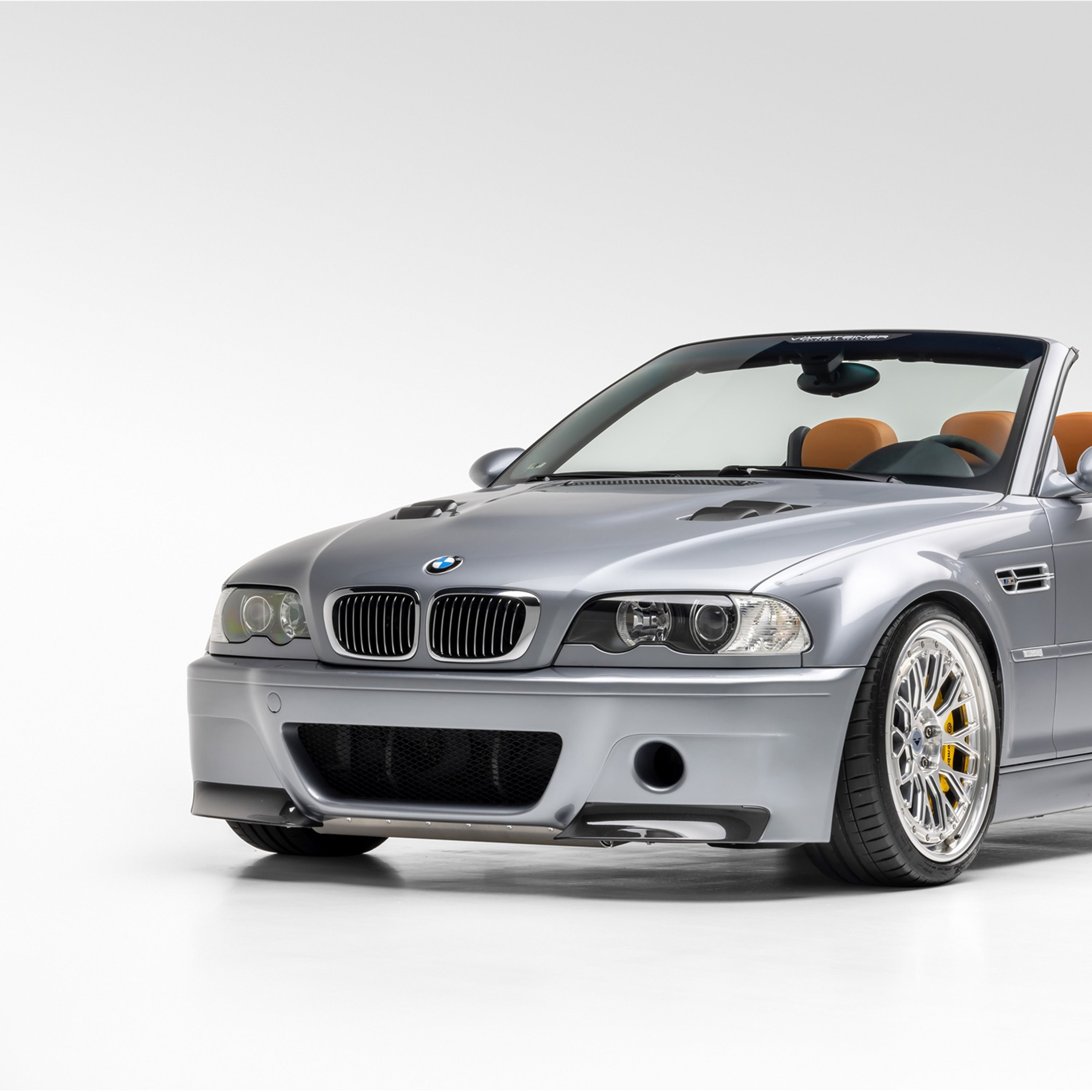 Silver E46 M3 with V20 hood, front 3/4 view of car