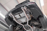 Capristo M3/M4 valved exhaust installed under a BMW M4, view from below