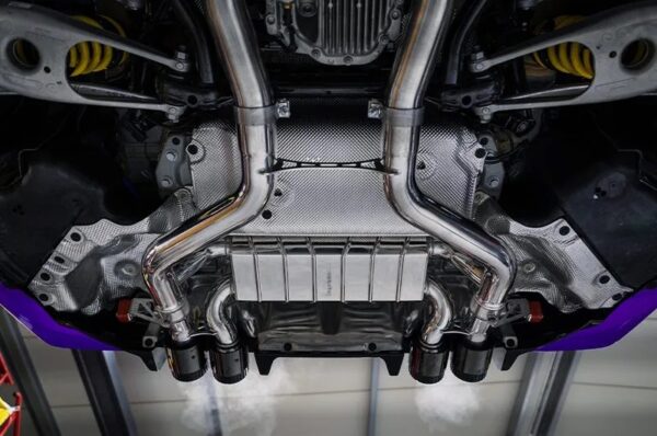 close view of Capristo Valved Exhaust w/ Mid-Silencer Delete 200 Cell OPF Replacement Wicrom Tips for BMW M2 G87 2023+ fitted inside a car