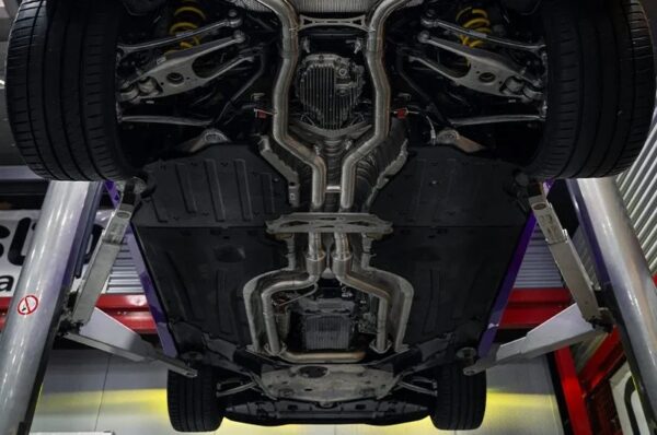 wide view of Capristo Valved Exhaust w/ Mid-Silencer Delete 200 Cell OPF Replacement Wicrom Tips for BMW M2 G87 2023+ fitted inside a car