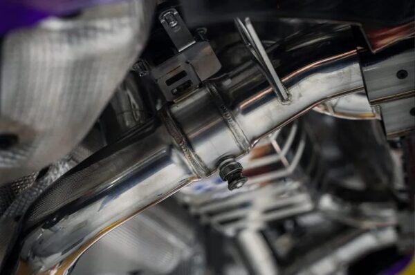 close view of Capristo Valved Exhaust w/ Mid-Silencer Delete 200 Cell OPF Replacement Wicrom Tips for BMW M2 G87 2023+ fitted inside a car