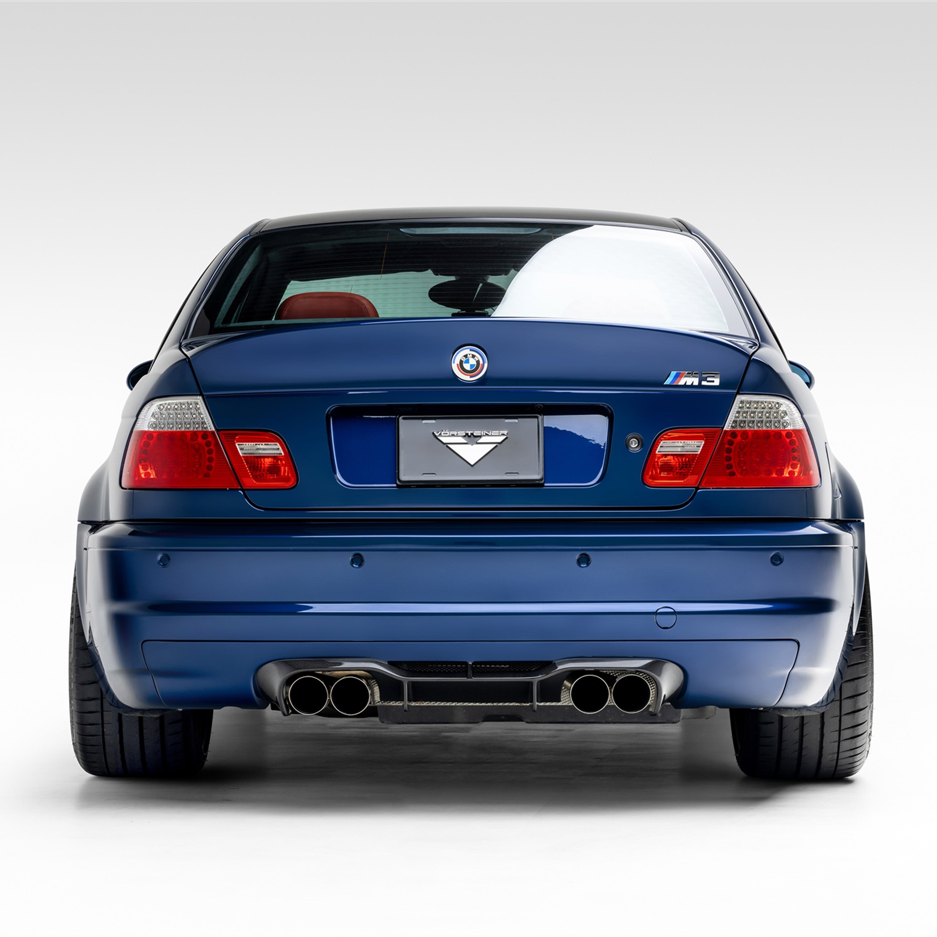 V-CSL ducktail bootlid on blue E46 M3, straight-on rear view