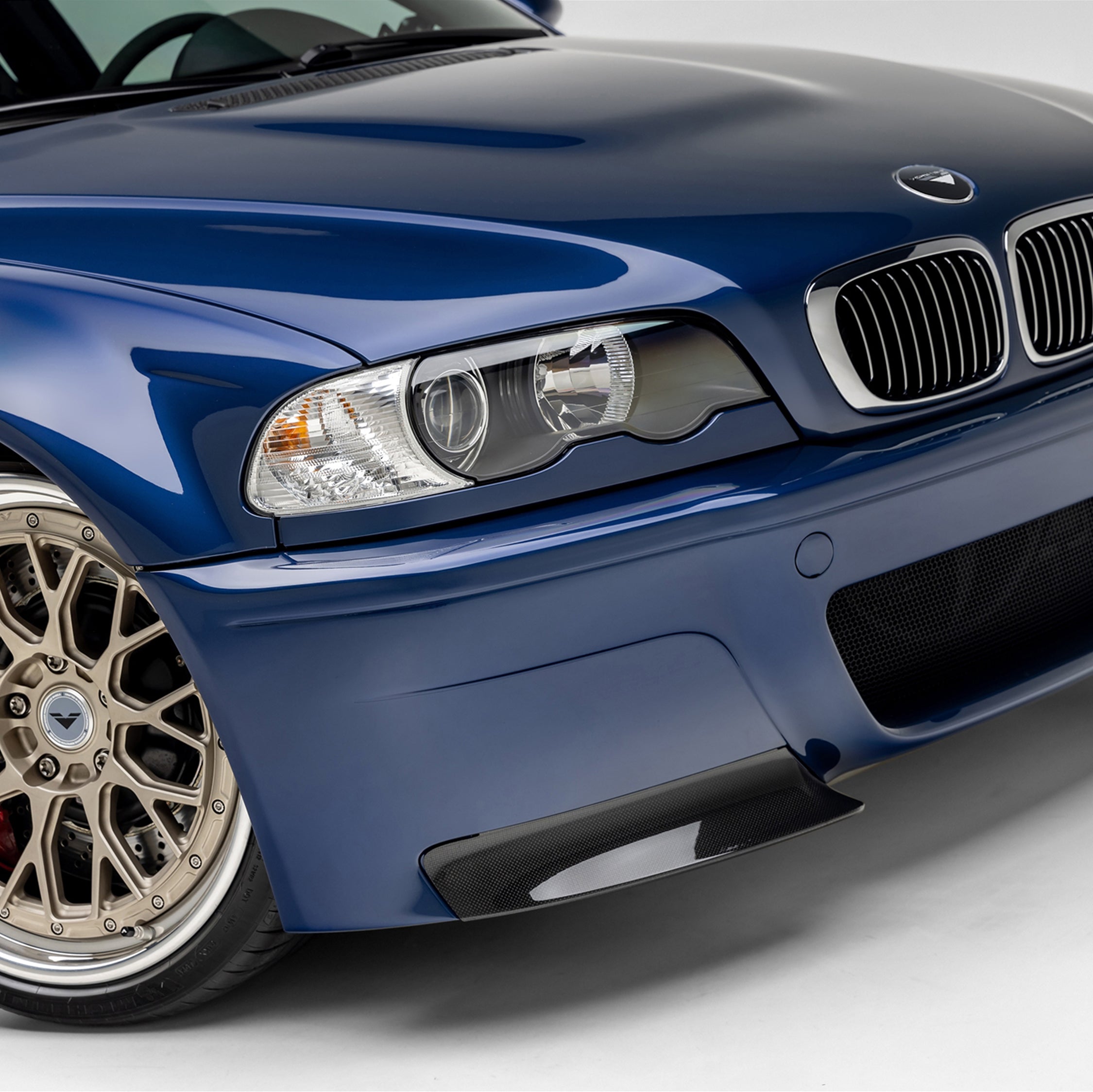 V-CSL splitter under E46 M3 bumper by wheel, close-up