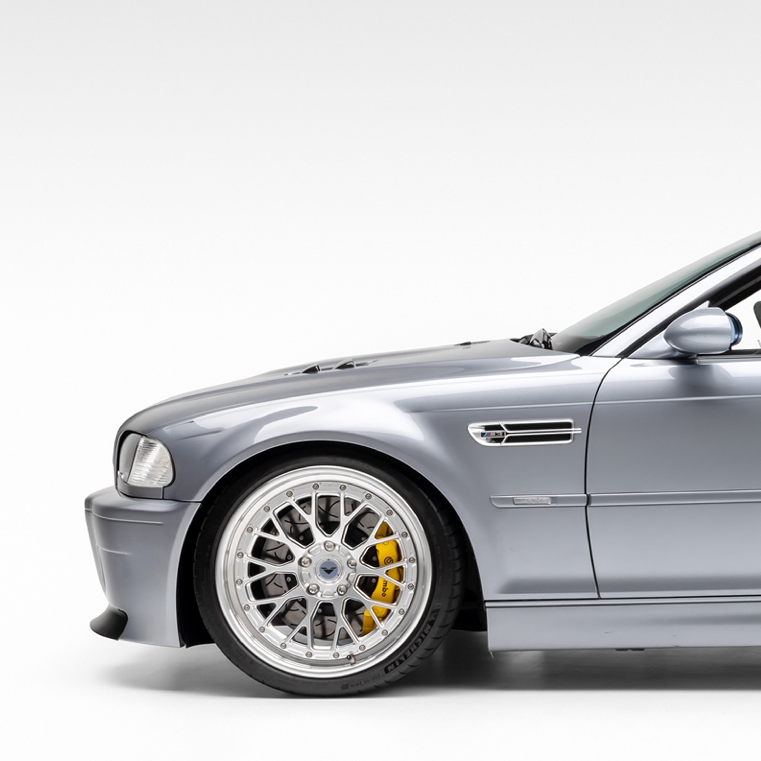 E46 M3 V-CSL bumper and front wheel, side 3/4 view