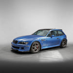 Blue M Coupe with roof spoiler, front 3/4 view