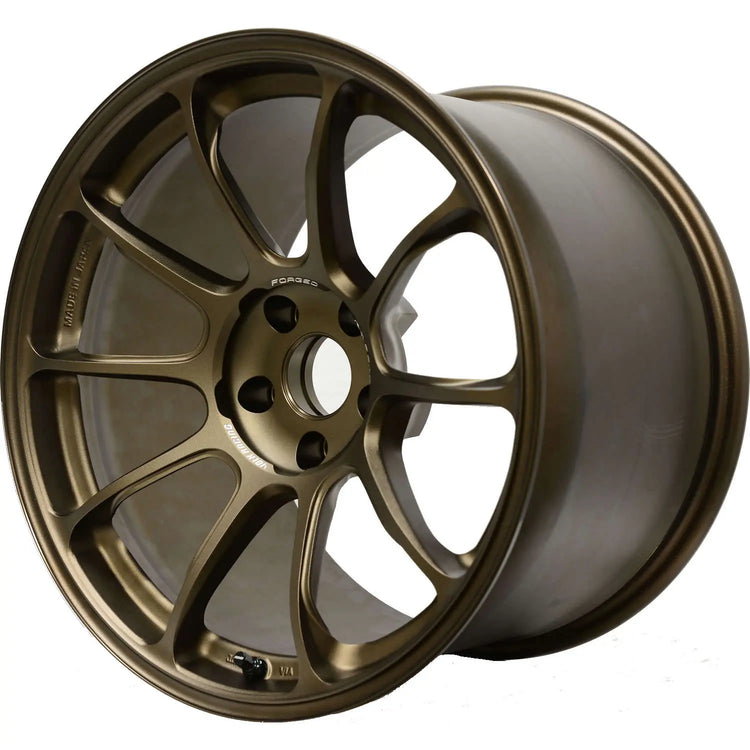 A front view of Volk Racing ZE40 Wheel 19x10.5 5x120 35mm Bronze with white background