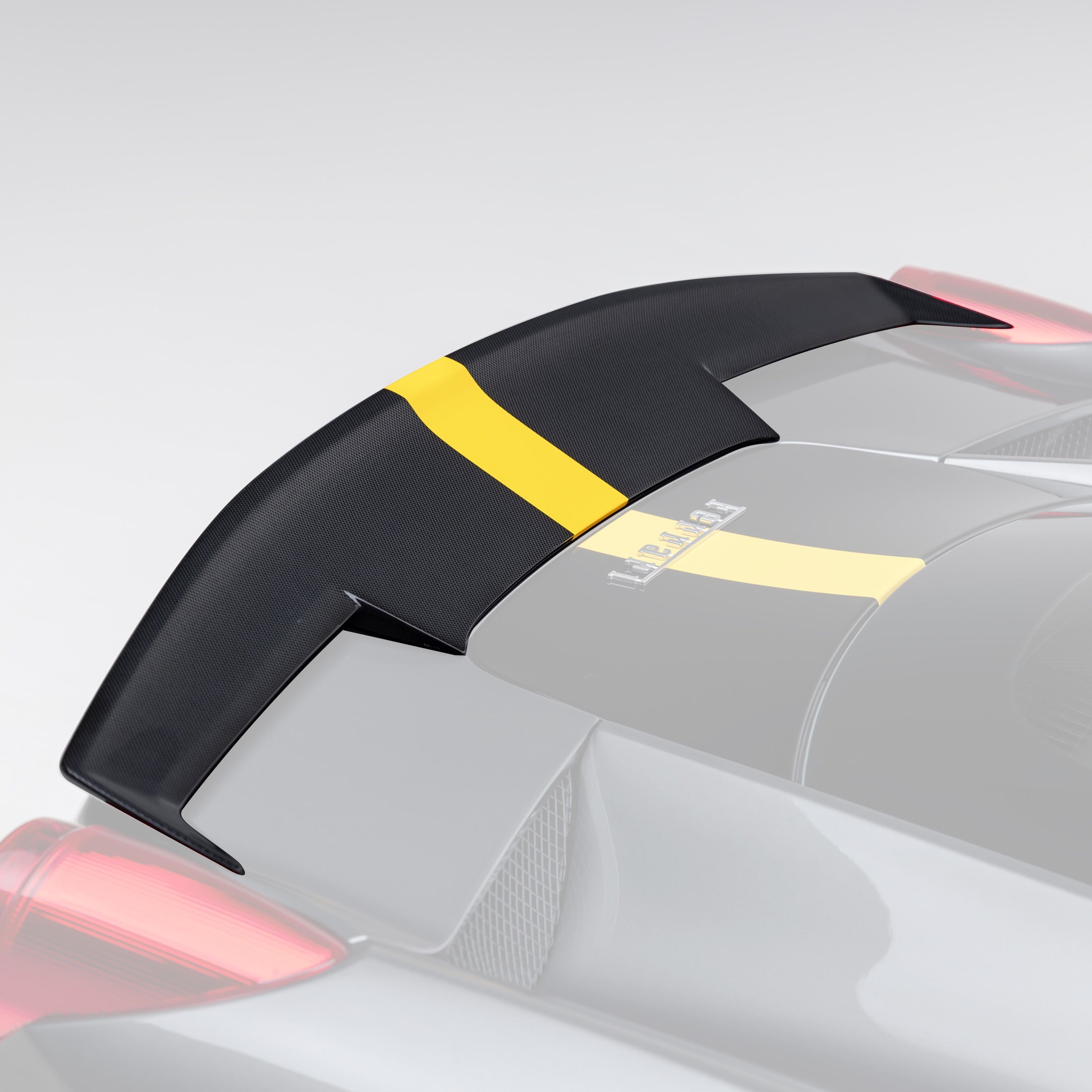 458 CTR decklid spoiler, faded close-up highlighting carbon