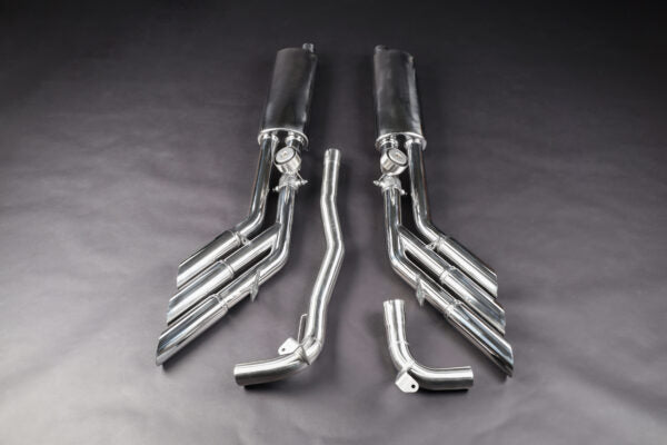 wide top view of Capristo Triple Tip Valved Exhaust with 250 Cell Sport Cat Downpipes for Jeep Wrangler 4xe 2021+ with black background