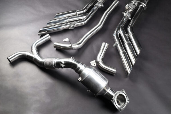 top view of Capristo Triple Tip Valved Exhaust with 250 Cell Sport Cat Downpipes for Jeep Wrangler 4xe 2021+ with black background