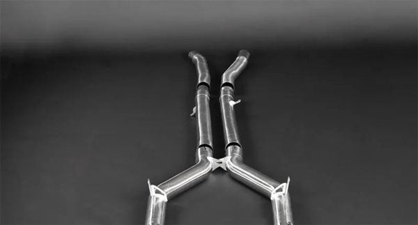 close top view of Capristo Valved Exhaust with Mid-Pipes (incl. Cat Delete) (OE Actuators) for Mercedes AMG GTR 2017-2021 with black background