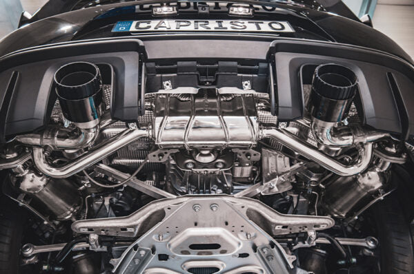 close top view of Capristo 100 Cell OPF Replacement Pipes for Porsche 718 GT4RS 2021-2025 fitted inside a car