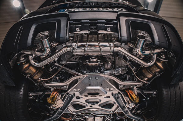 wide bottom view of Capristo Valved Muffler (CES3) for OE Tips for Porsche 718 GT4RS 2021-2025 fitted inside a car