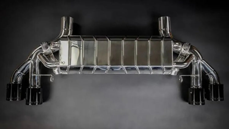 wide view of Capristo Exhaust Valved Exhaust w/ Pre-Silencer Race Pipes & Wicrom Tips for BMW M5 F90 2017-2022 with black background