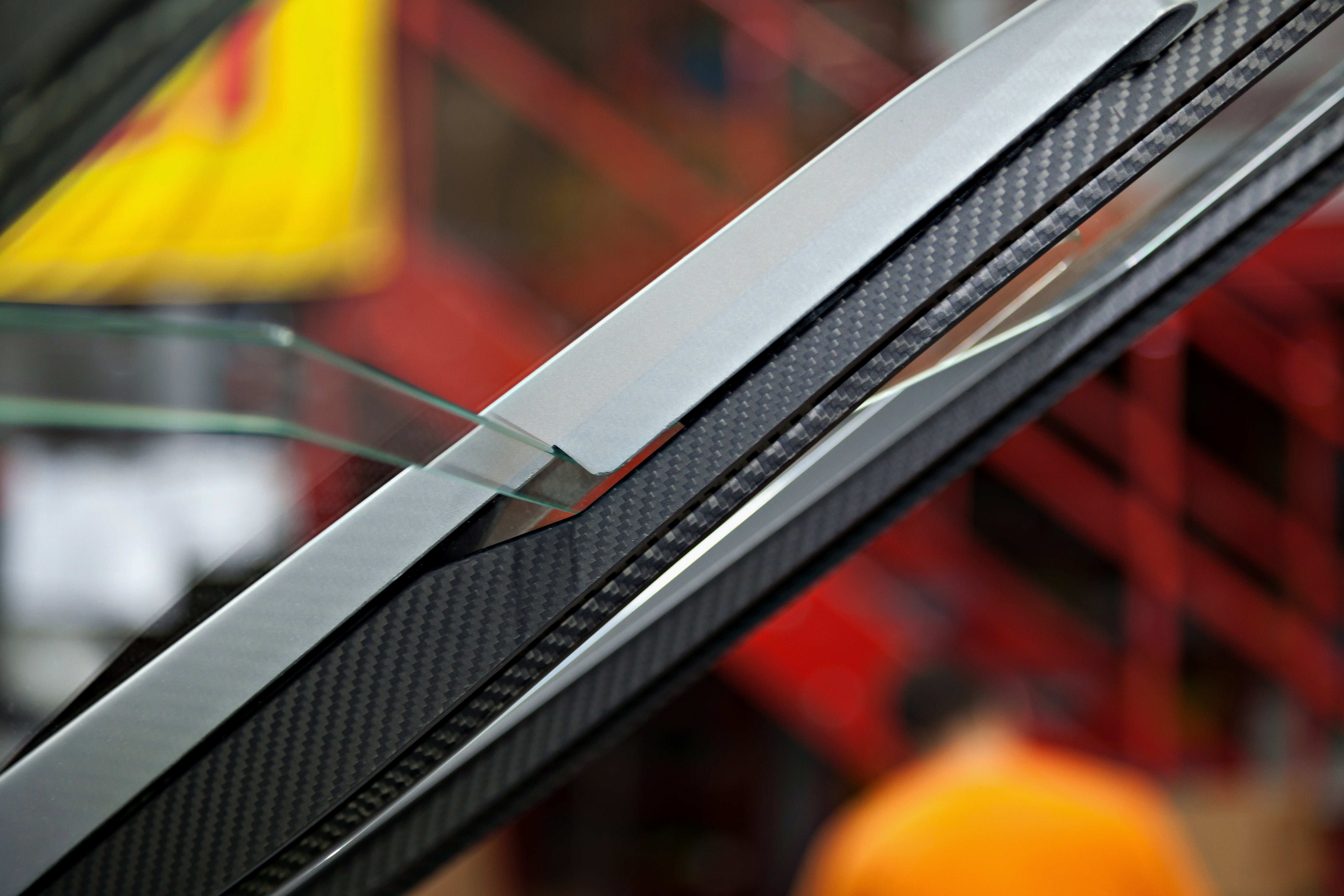 Close-up of carbon frame on Capristo Huracan glass bonnet