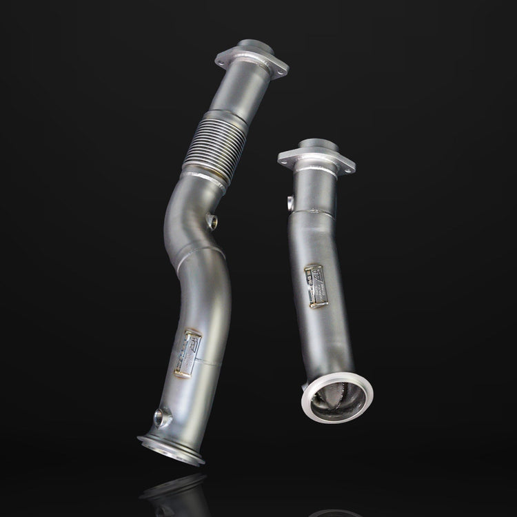 A front view of IPE SS Catless Downpipe for BMW M2 / M3 2021-2025 with black background