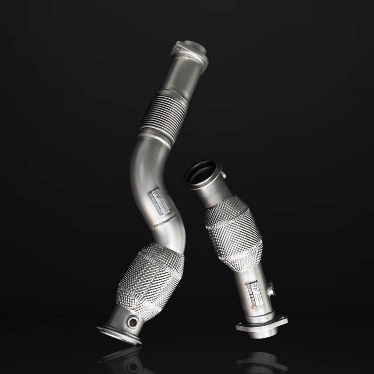 A front view of IPE SS Catted Downpipe for BMW M2 / M3 2021-2025 with black background