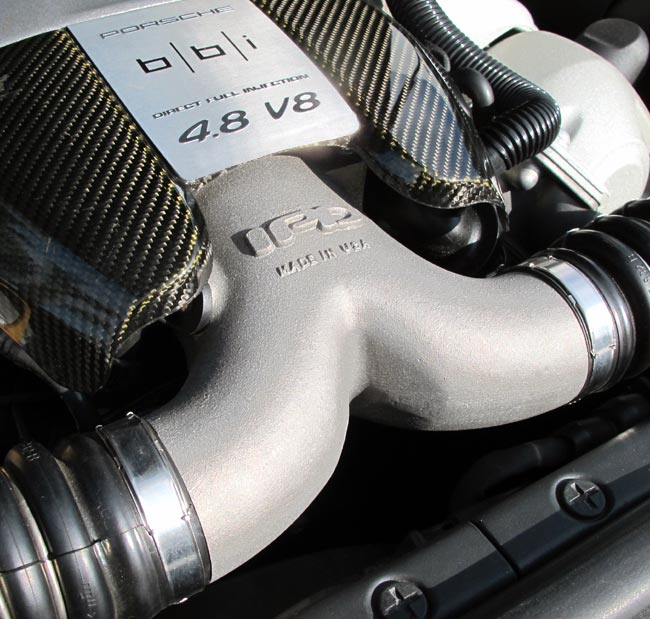 IPD plenum installed on a Porsche 4.8 V8 direct-injection Cayenne Turbo engine under the carbon engine cover - IPD for Porsche 958 Cayenne Turbo