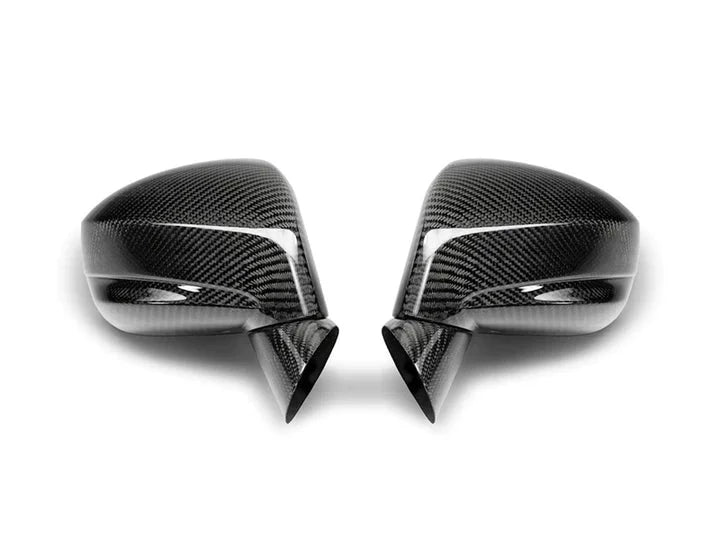 A top view of AUTOTECKNIC REPLACEMENT DRY CARBON MIRROR COVERS - NISSAN R35 GTR 2009+ with white background