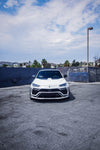 White Lamborghini Urus front view with the complete aero kit in a parking lot