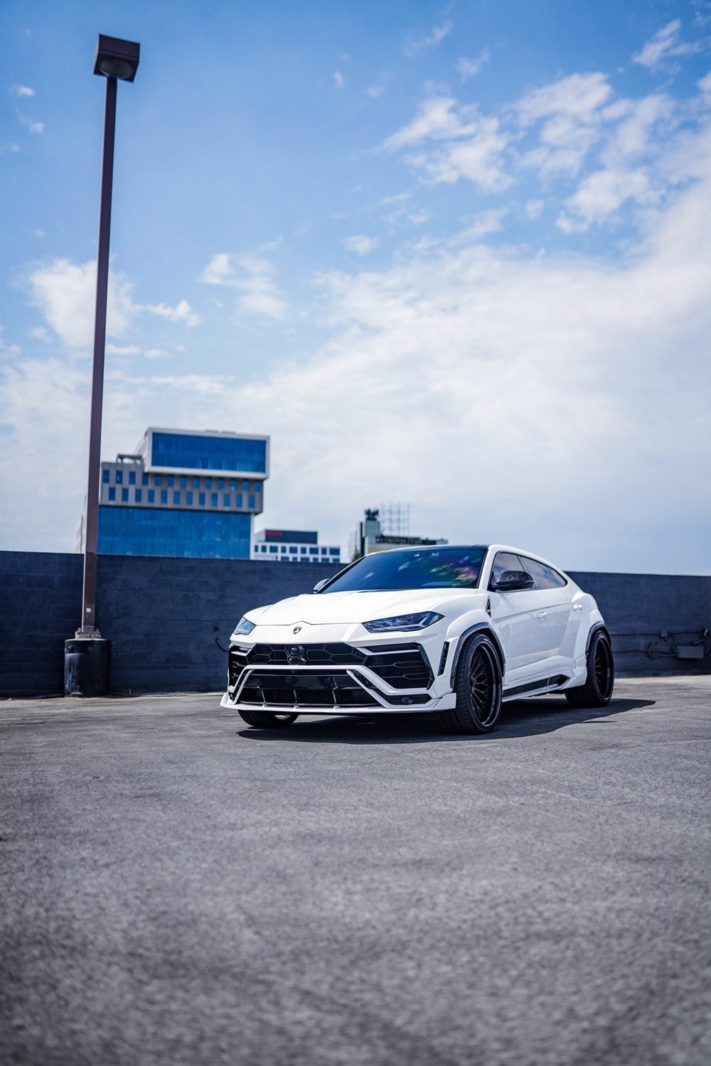 White Lamborghini Urus with the complete aero kit, wide shot