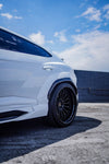Rear widebody fender on a white Urus, low angle