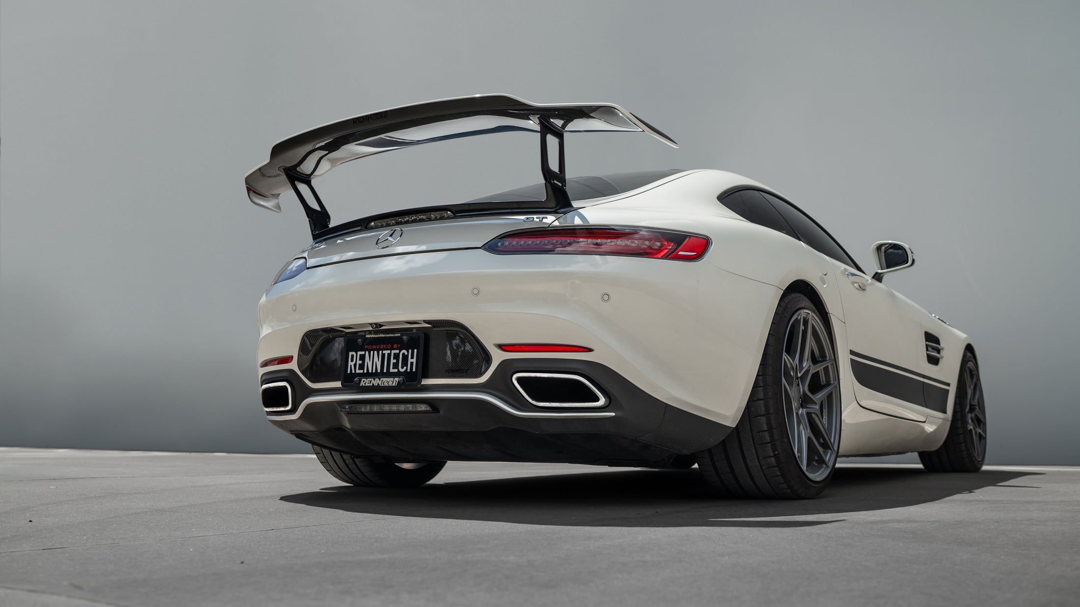 Rear of the white AMG GT car showing the bumperette delete and wing - Carbon Bumperette Delete for the 2016-2021 AMG GT