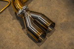 Valvetronic Designs F1 Exhaust McLaren 650S / MP4-12C manufacturer gallery: two polished outlet tips attached to a gold-colored branch