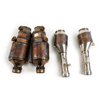 Factory Artura catalytic converters beside the Fabspeed sport cats