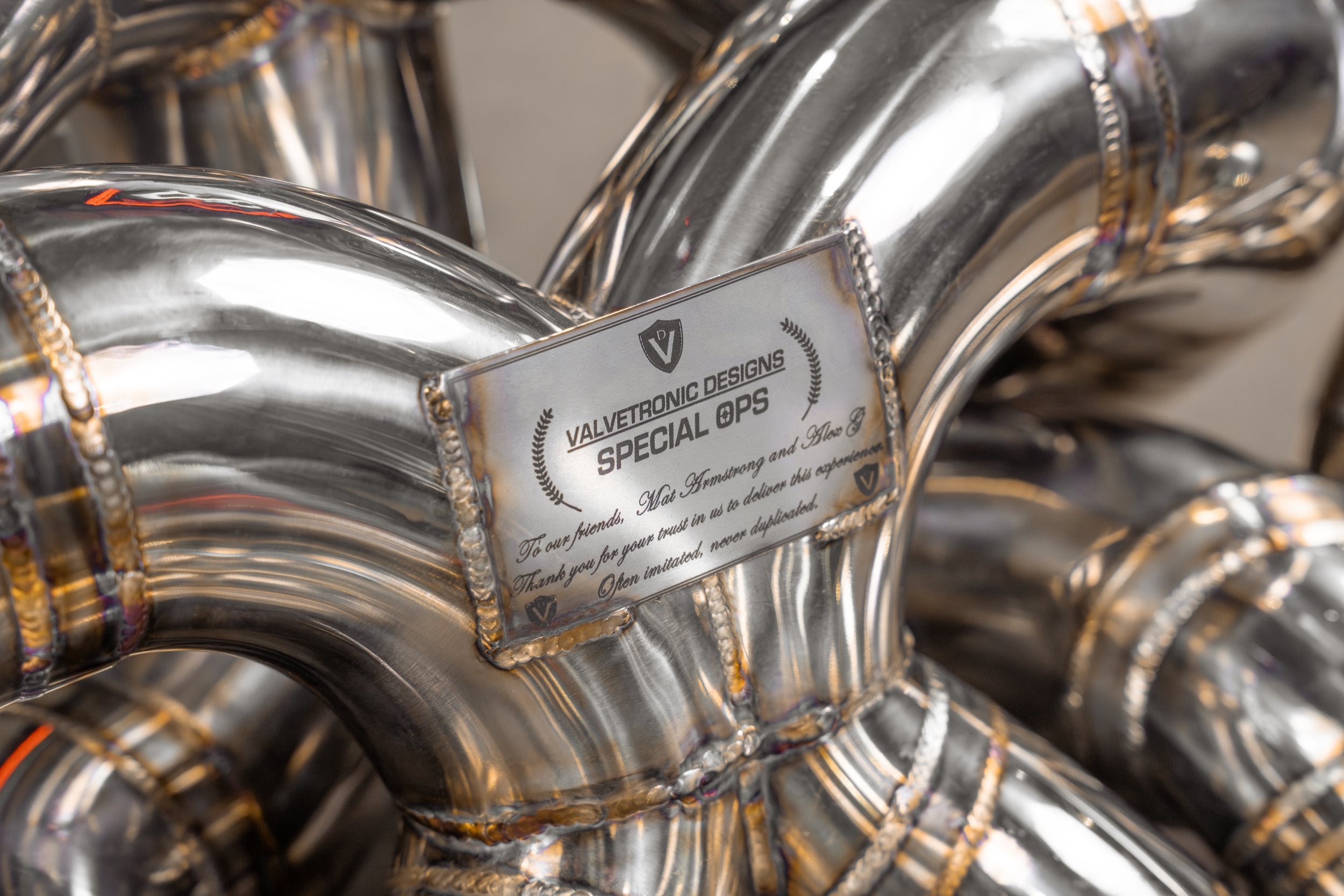 Valvetronic Designs F1 Exhaust Bugatti Chiron Pur Sport manufacturer gallery: Special 004 identification plate between curved tubes