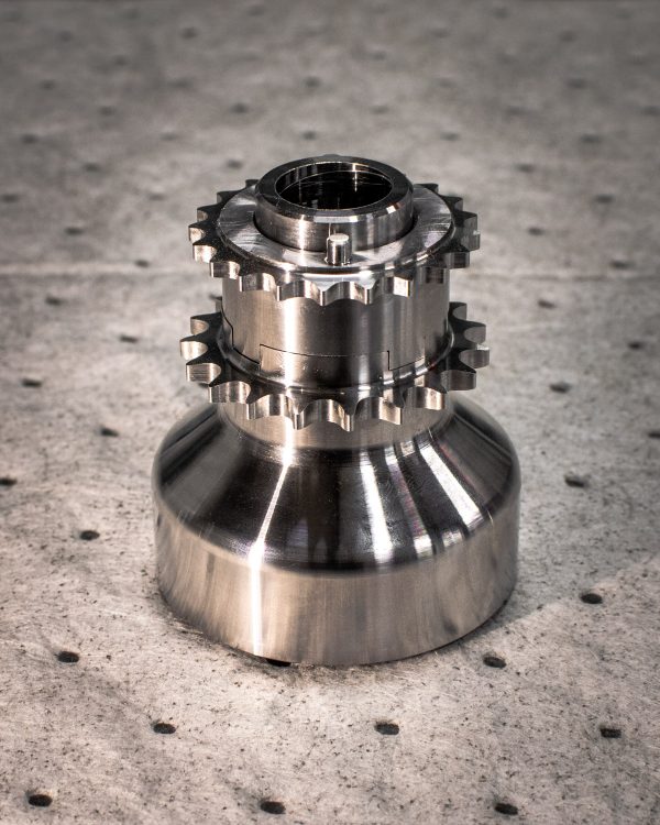 A close up view of RK Autowerks S55 BILLET PINNED CRANK HUB on a table