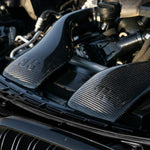 A close up view of RK Autowerks F85 F86 X5M & X6M CARBON FIBER INTAKES fitted on a car