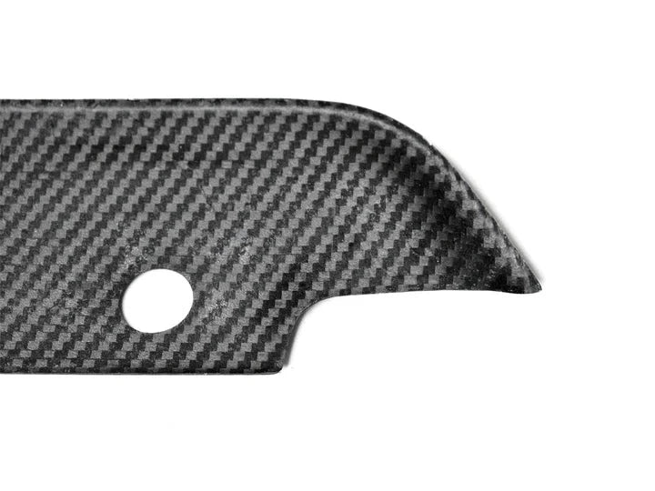 A close up view of AUTOTECKNIC DRY CARBON FIBER BUMPER TRIM - F97 X3M | F98 X4M PRE-LCI 2019-2021 with white background