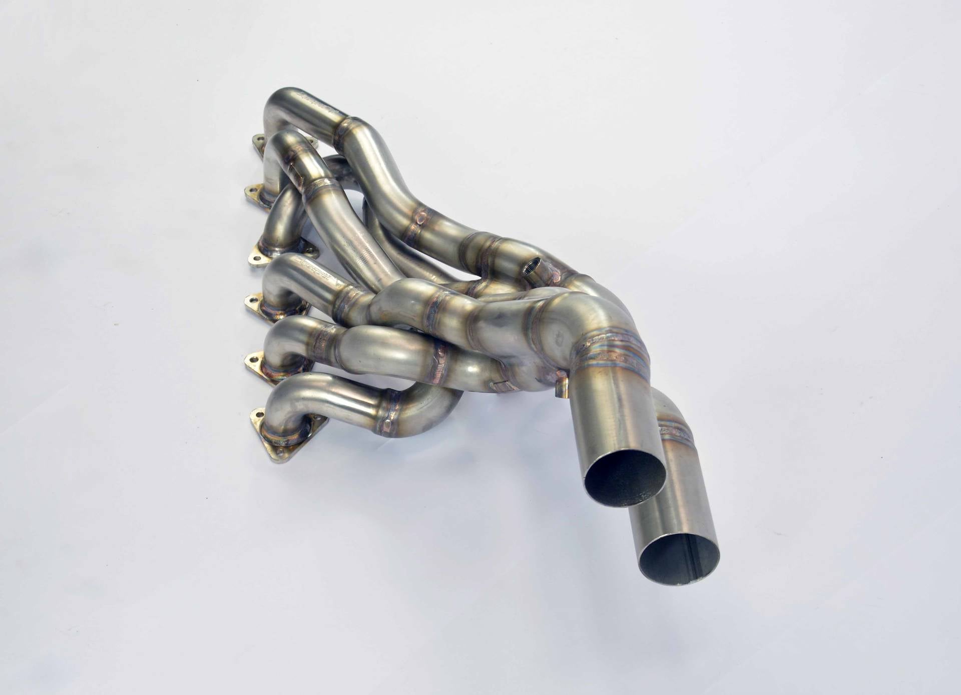 front view of Supersprint Manifold - Step Design (Right Hand Drive) for BMW E36 All models 1990-2000 with white background