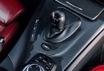 A top close up view of AUTOTECKNIC CARBON FIBER GEAR SELECTOR COVER - BMW E9X M3 2007-2013 fitted in a car