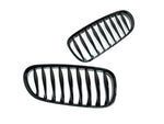 A side wide view of AUTOTECKNIC GLAZING BLACK FRONT GRILLE SET - E85 Z4 / Z4M 2002-2008 with white background