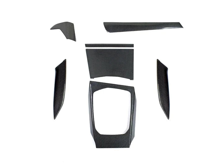 A top view of AUTOTECKNIC DRY CARBON FIBER INTERIOR TRIM - BMW G80 M3 | G82/ G83 M4 2020+ with white background