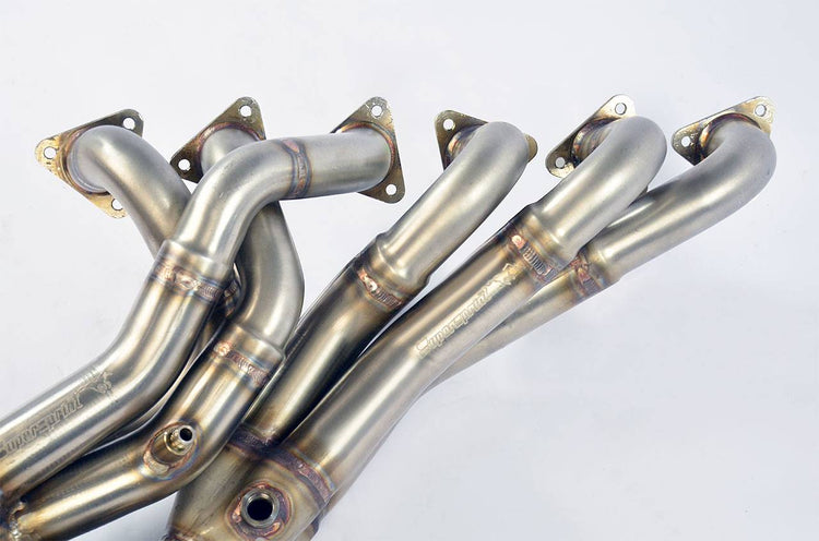 close top view of Supersprint Manifold - Step Design (Left Hand Drive) for BMW E30 - S54 engine conversion 1982-2006 with white background