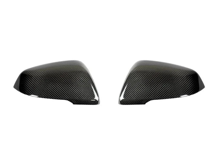 A front view of AUTOTECKNIC REPLACEMENT CARBON FIBER MIRROR COVERS - BMW F45 2-SERIES 2014+ with white background