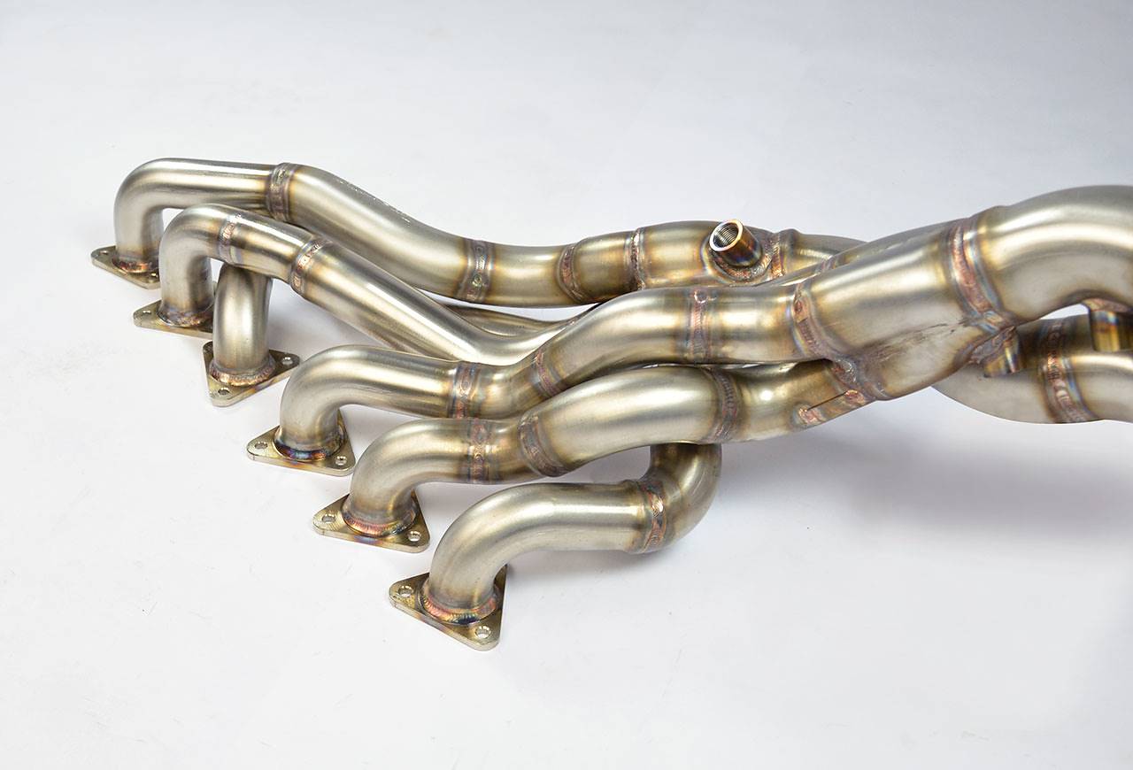 close side view of Supersprint Manifold "Step Design" (Replaces OEM catalytic converter) (Left / Right Hand Drive) for BMW E46 M3 3.2i Coupé/Cabrio 2001-2006 (USA Model Ø60mm - Single Pipe) with white background