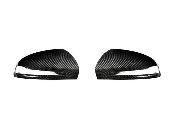A front view of AUTOTECKNIC REPLACEMENT VERSION II DRY CARBON MIRROR COVERS - MERCEDES-BENZ W257 CLS-CLASS 2022+with white background