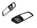 A front view of AUTOTECKNIC DRY CARBON INTERIOR DOOR HANDLE TRIM SET - BMW Models with white background