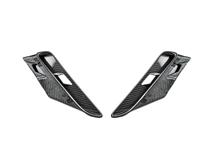 A front view of AUTOTECKNIC DRY CARBON FIBER FENDER POCKET SET - BMW F90 M5 | M5 COMPETITION 2017+ with white background