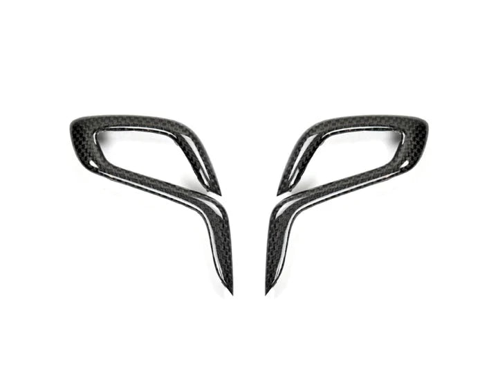A front view of AUTOTECKNIC CARBON FIBER GEAR SELECTOR SIDE COVERS - BMW F90 M5 2018+ with white background