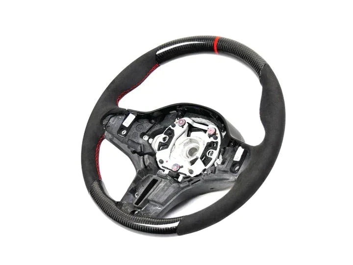 A front view of AUTOTECKNIC REPLACEMENT CARBON STEERING WHEEL - BMW Models with white background