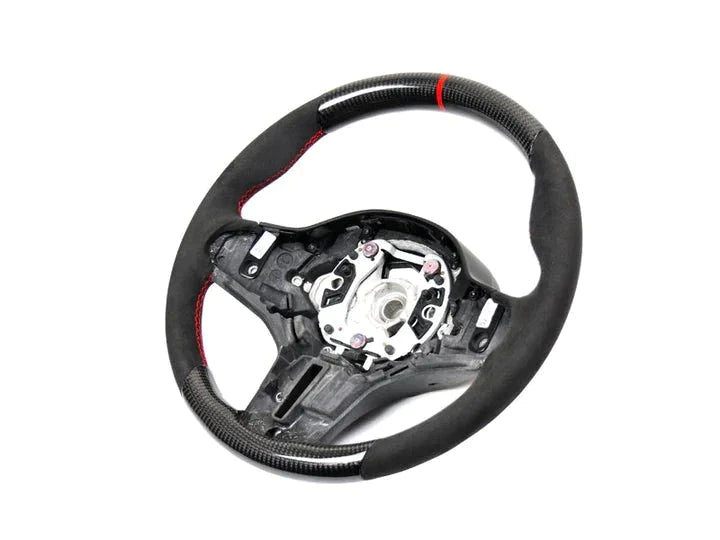 A front view of AUTOTECKNIC REPLACEMENT CARBON STEERING WHEEL - BMW Models with white background