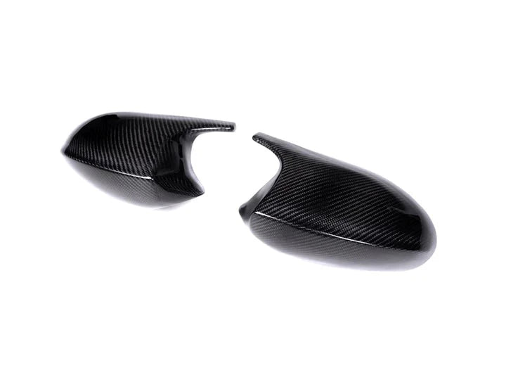 A front view of AUTOTECKNIC CARBON M-INSPIRED MIRROR COVERS - BMW E90/ E92/ E93 3-SERIES | E82 1-SERIES PRE-LCI 2005-2010 with white background